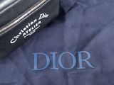 a black bag sitting on top of a blue cloth