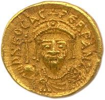 une pièce d'or sur laquelle est représenté le visage d'un homme