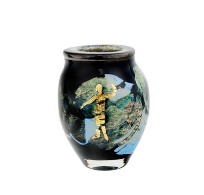 a black vase with a picture of a man on it