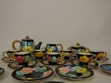 a lot of plates and cups that are on the table