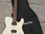 an electric guitar sitting on the ground next to a guitar case