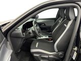 the interior of a car with the door open and the driver ' s seat up