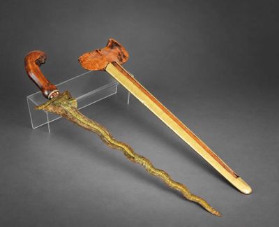 a wooden and metal sword with a wooden handle and a wooden handle