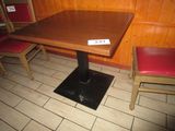 a wooden table with a sign on it in a restaurant