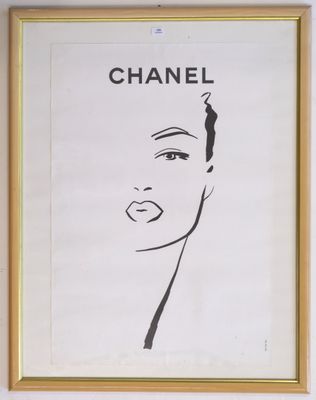 chanel, a portrait of a woman ' s face in black and white, hangs on a wall