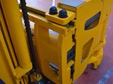 a fork lifter that is sitting in a warehouse