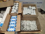 several boxes filled with white and blue items sitting on top of a floor