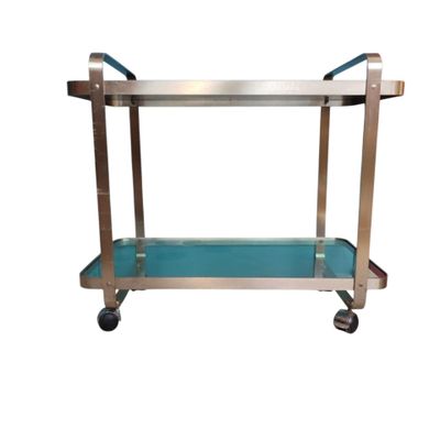 un chariot de service à roulettes en acier inoxydable et en verre bleu
