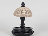 a black and white table lamp with a shell shade on top