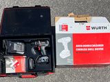 a box with a drill and a cordless drilldriver in it