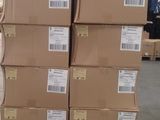 a large stack of boxes sitting on a pallet in a warehouse