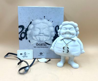 a small figurine of a man with a beard and a tie