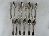 a lot of silver spoons and forks on the table