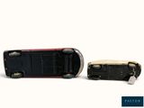 a toy car that is sitting next to another toy car