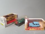 two toy cars that are in a box on the table