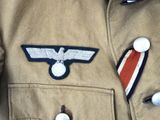 a close up of a military uniform with a badge on it