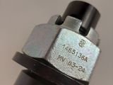 a close up of a metal object on a white surface