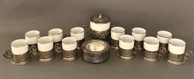 many cups and saucers sitting on a table