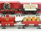 three toy trains that are sitting on the tracks