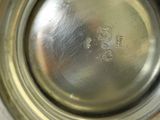 a close up view of a silver cup with a metal lid