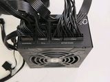a picture of a computer power supply with cables and wires