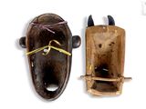two pieces of wood with horns on them on a white background