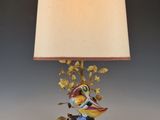 an image of a lamp with a bird on it