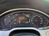 a close up of a car dashboard with various gauges