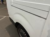 a white van that is parked in a parking lot