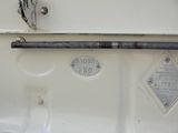 a close up of a white boat with a metal handle