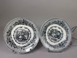 pair of black and white plates with a picture of a man and a woman on them