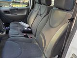the interior of a car with the front seats folded down