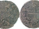 a close up of a coin with a cross on it