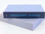 two books stacked on top of each other on a white surface