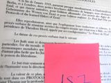 a piece of paper that has a pink sticker on it