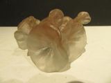 a glass figurine that is sitting on a table
