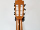 an image of a wooden guitar stand with a guitar in it