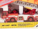a toy fire truck with a ladder in the box