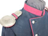 an image of a blue military jacket with pink trims