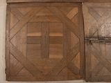 two pieces of wood on the floor next to each other