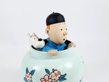 a figurine of a man and a dog in a vase