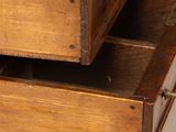 a wooden desk with two drawers on top of it