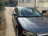 a black car parked on the side of the road