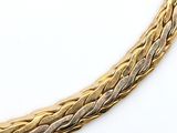 an image of a close up of a gold necklace on a white surface