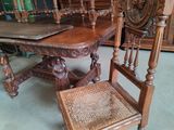 a chair and a table in a room with a lot of books