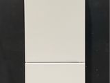 a white refrigerator that is sitting on the floor