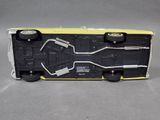 a close up of a toy truck on a gray surface