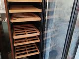 a refrigerator that has a bunch of shelves inside of it