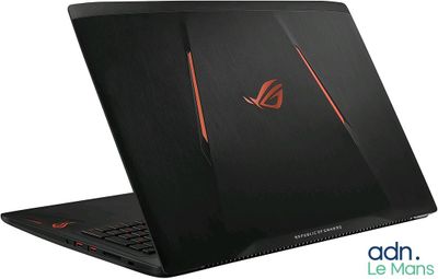 a laptop with a red and black logo on the screen