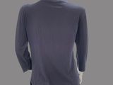 an image of a mannequin mannequin wearing a blue shirt and black pants